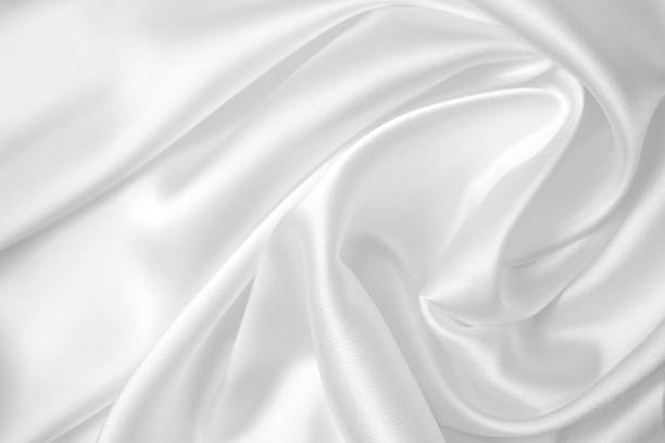 istock Smooth elegant white silk or satin luxury cloth texture can use as wedding background. Luxurious Christmas background or New Year background design 1407620637