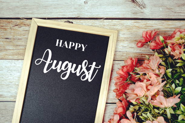 istock Happy August text on blackboard with flower bouquet decoration 1407622950