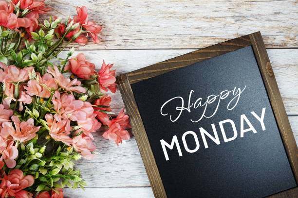 istock Happy Monday text on blackboard with flower bouquet decoration 1407622992