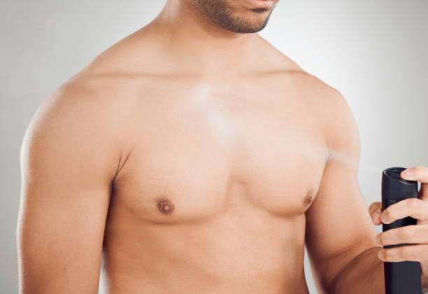istock Cropped shot of an unrecognizable man applying deodorant while posing against a grey background 1407631314