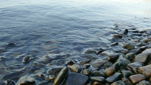 Waves Calmly Beating the Stones on the Shore