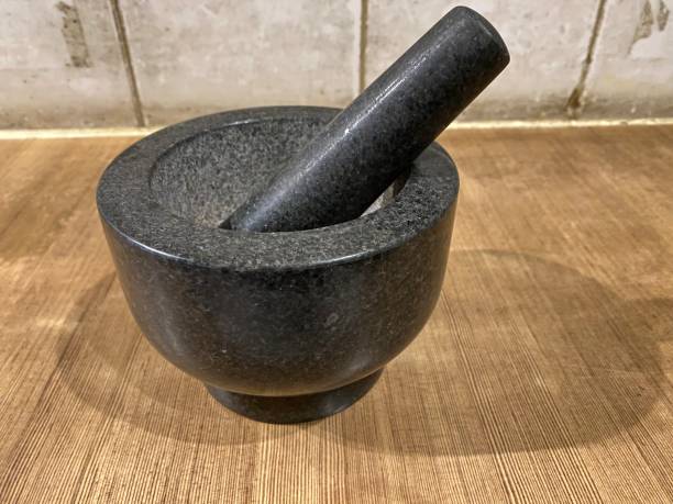 istock Selected focus for ancient mortar made of stone 1407634276