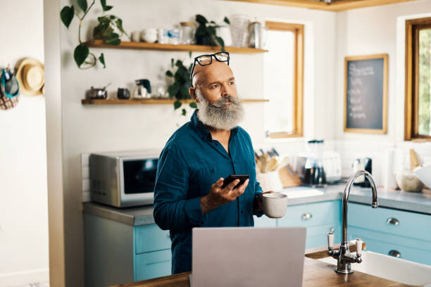 istock Mature manager talking and discussing plans with his team Pensive freelancer using modern technology for inspiration. Mature manager talking and discussing plans with his team. 1407635606