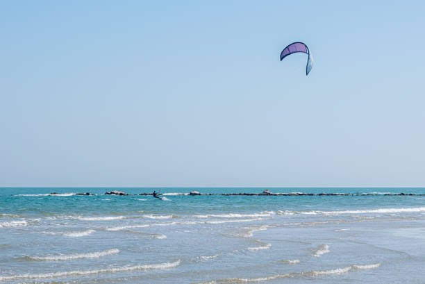 Kite surfing in Pesaro, Marche region of Italy, on the Adriatic sea during a sunny and windy summer day
