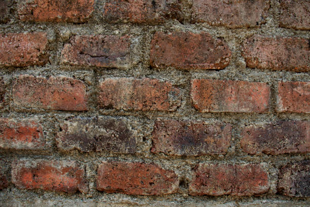 istock Old brick wall with red brick Background of brick wall texture red stone wall pattern. 1407642484