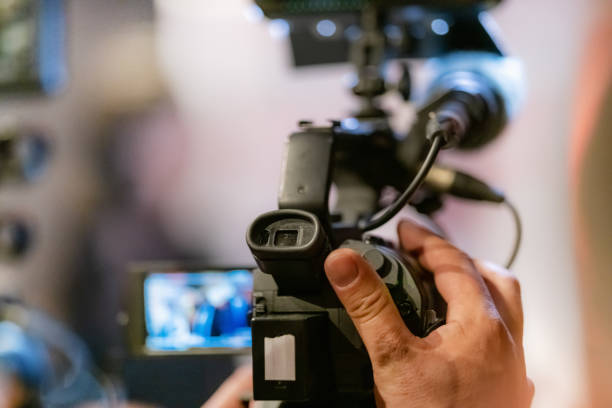 istock Television camera at an evening press conference 1407642631