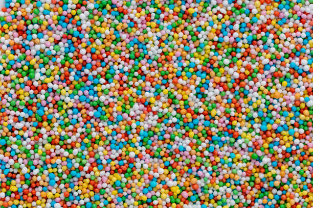 istock Thousands sprinkles tiny sugar beads for decorating cakes and desserts background. 1407642750
