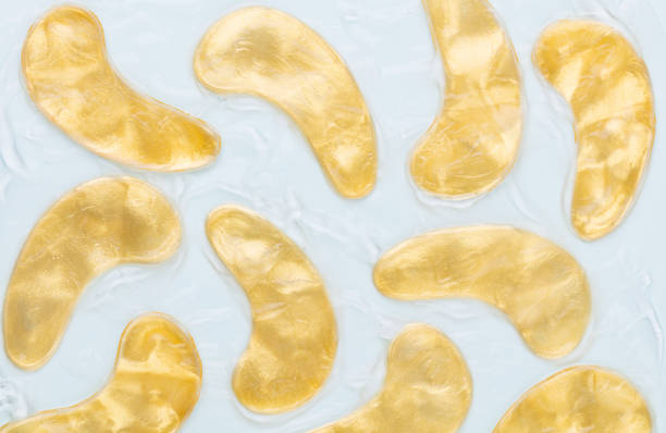 istock Gold hydrogel eye patches background. 1407646650