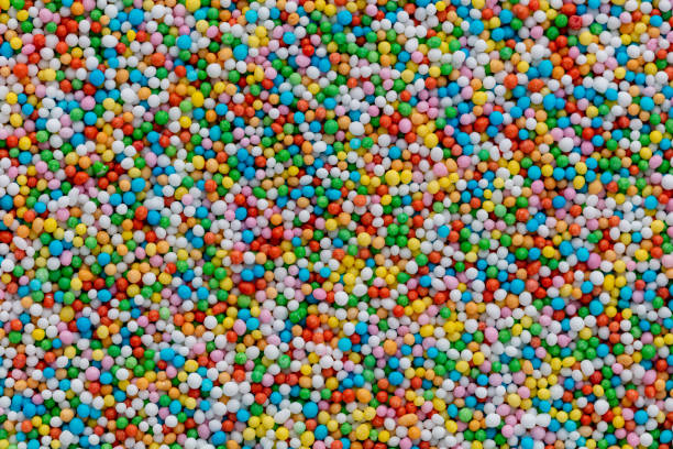 istock Thousands sprinkles tiny sugar beads for decorating cakes and desserts background. 1407646665