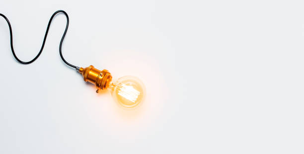 istock Creative idea concept, designer lamp, modern interior item. Vintage fashionable edison lamp on light gray background. Top view flat lay copy space. Lighting, electricity, background with lamp 1407647622