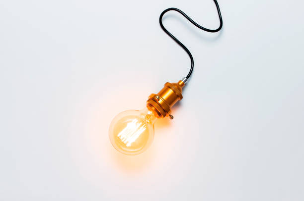 istock Creative idea concept, designer lamp, modern interior item. Vintage fashionable edison lamp on light gray background. Top view flat lay copy space. Lighting, electricity, background with lamp 1407647628