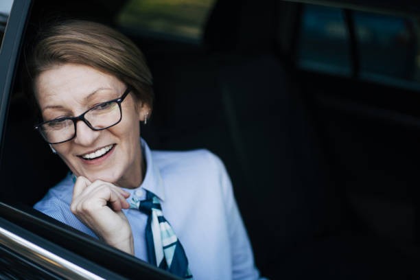 istock Mature woman driving a car. 1407649348