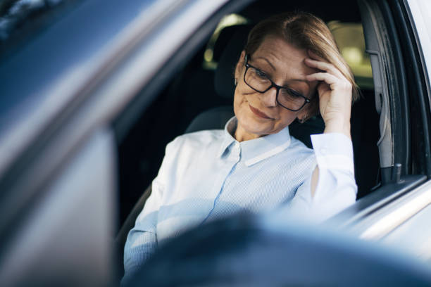 istock Mature woman driving a car. 1407650153