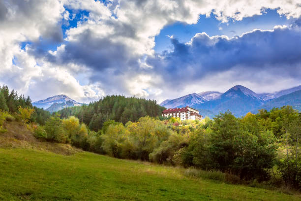 Bansko, Bulgaria autumn town panorama of bulgarian ski resort with Pirin mountain peaks and trees