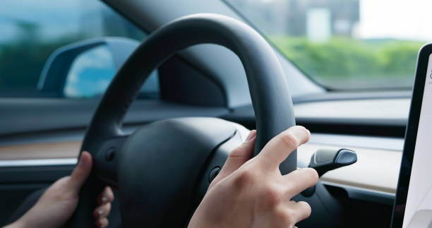 istock Asian Man Driving Car 1407650771