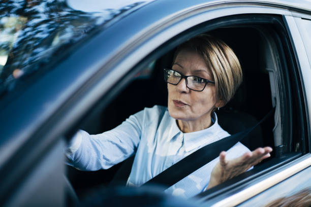 istock Mature woman driving a car. 1407651373
