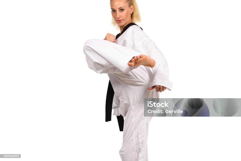 Protected Martial artist training. Kicking Stock Photo