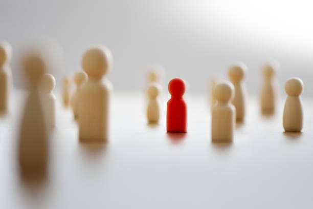 istock The red human figure extends its influence to the neighboring figures. 1407653992