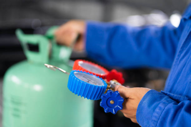 istock Check car air conditioning system refrigerant recharge. 1407654695