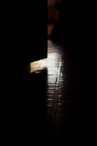 istock Parquet on floor. Light on floor. Details of old interior. 1407655040