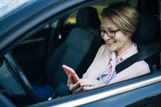 istock Mature woman driving a car. 1407656294