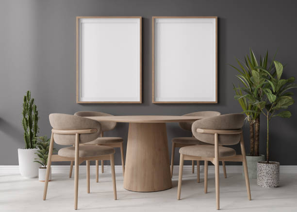 istock Two empty vertical picture frames on gray wall in modern dining room. Mock up interior in contemporary, scandinavian style. Free space for picture, poster. Wooden table, chairs, plants. 3D rendering. 1407656316