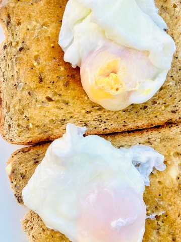 Poached eggs served on seeded wholemeal toast