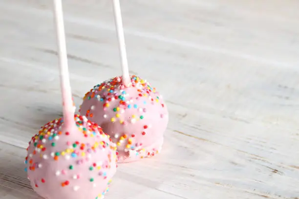 Dessert pink round stick cake. Sweetness on the table