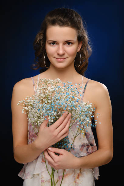 istock girl with flowers 1407669991