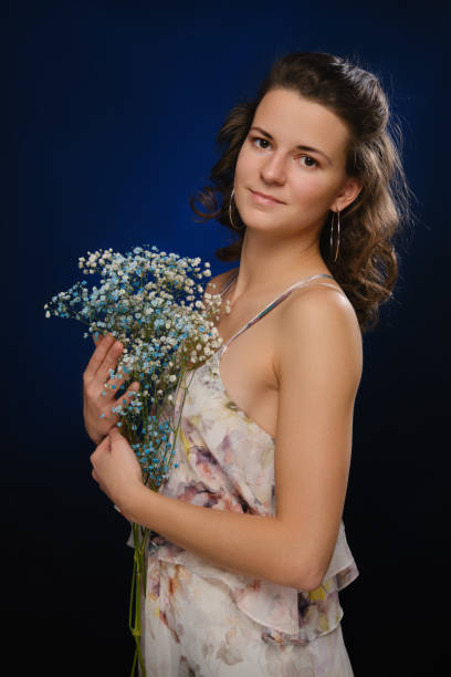 istock girl with flowers 1407670033