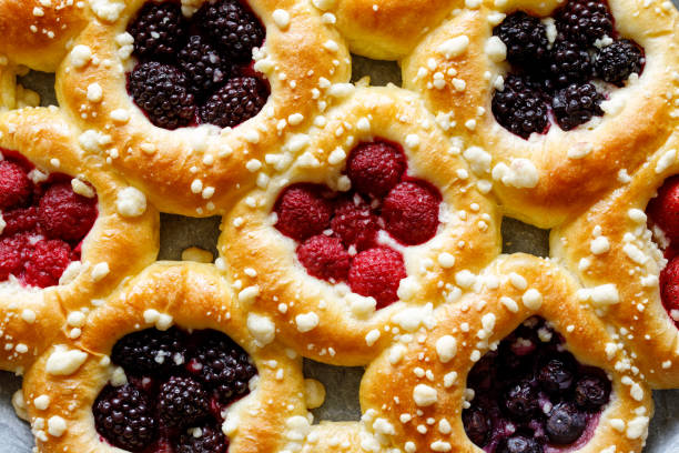 Homemade sweet yeast buns with the addition of berry fruit such as ; blackberry, raspberry blueberry and butter crumble