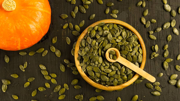 istock Healthy ripe pumpkin and pumpkin seeds 1407672976