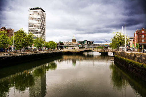 Dublin, Ireland - May 22, 2022: Millenium Bridge e Liffey riverCastle in Temple Bar quarter in the centre of Dublin, Ireland.