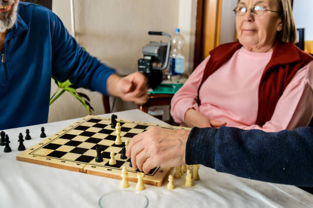 istock A small group of older people is playing chess. 1407680540