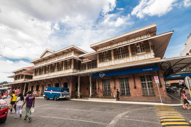 Tondo, Manila, Philippines - The old Tutuban station, now the main building of the Tutuban shopping complex. Tondo, Manila, Philippines - Dec 2021: The old Tutuban station, now the main building of the Tutuban shopping complex. divisoria market stock pictures, royalty-free photos & images
