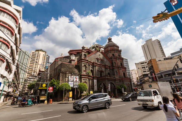 Binondo, Manila, Philippines - Binondo church and the cityscape around Plaza Lorenzo Ruiz. Binondo, Manila, Philippines - Dec 2021: Binondo church and the cityscape around Plaza Lorenzo Ruiz. manila streets stock pictures, royalty-free photos & images