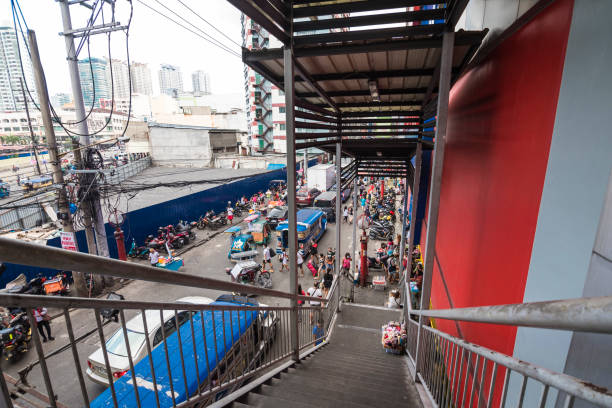 Divisoria, Manila, Philippines - A busy scene along Soler Street, as seen from the stairway of a pedestrian overpass. Divisoria, Manila, Philippines - Dec 2021: A busy scene along Soler Street, as seen from the stairway of a pedestrian overpass. divisoria market stock pictures, royalty-free photos & images