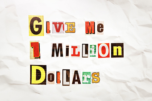 Retro ransom note on a page of crumpled paper demands: Give me 1 million dollars.