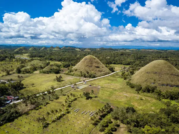 Photo of A cluster of the famed Chocolate Hills. A popular tourist spot and common sight in the town of Sagbayan, Bohol, Philippines.