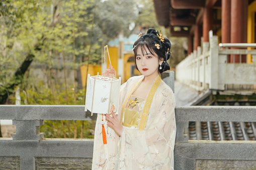 An outdoor portrait of a beautiful woman in Chinese Han Costume