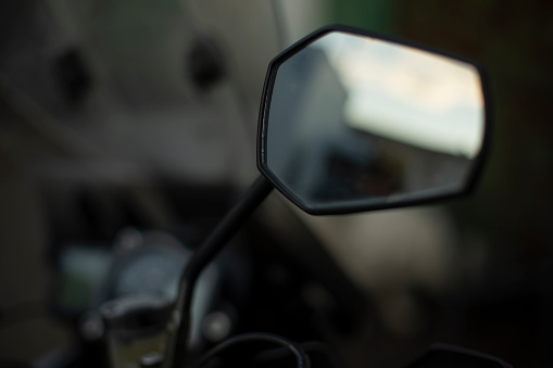 Rear-view mirror of motorcycle. Transport details. Road view tool. Overview mirror.