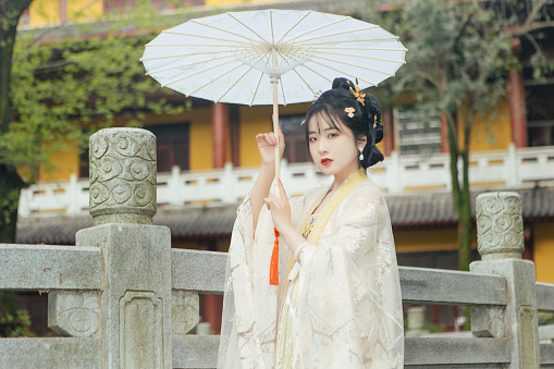 An outdoor portrait of a beautiful woman in Chinese Han Costume