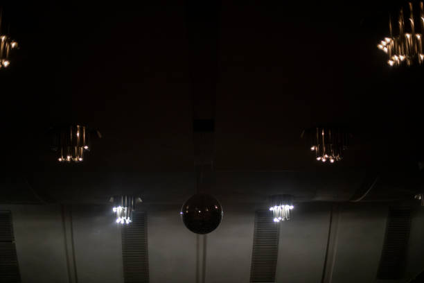 Lamps in interior. Light in room. Ceiling in apartment.