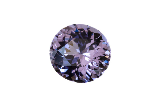 Faceted Lilac-colored Spinel gemstone from Sri Lanka. Slight Oval/near round, 7x7.6mm. Weight 1.64 carats. Photographed with white background.