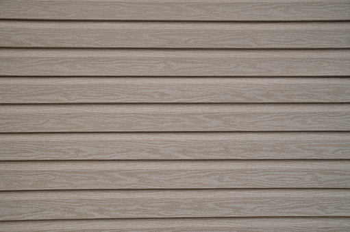 External insulation with american siding imitating wood closeup