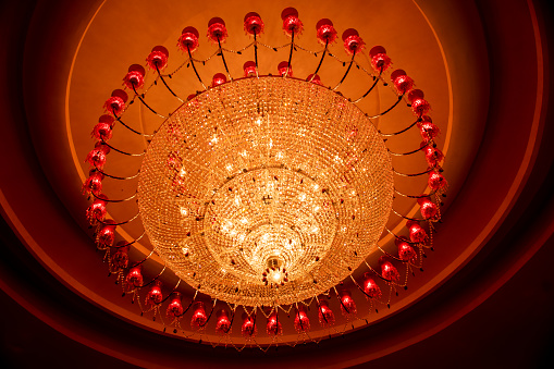 This is a picture of a big chandelier used in a Durga Puja Pandal.