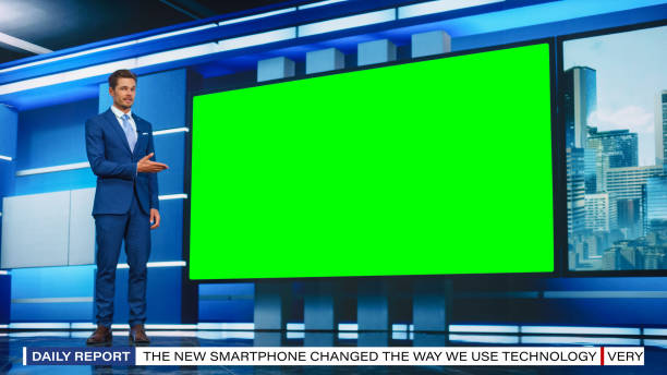 Talk Show TV Program: Handsome White Male Presenter Standing in Newsroom Studio, Uses Big Green Chroma Key Screen. News Achor, Presenter Talks About News, Weather. Mock-up of Cable Channel Talk Show TV Program: Handsome White Male Presenter Standing in Newsroom Studio, Uses Big Green Chroma Key Screen. News Achor, Presenter Talks About News, Weather. Mock-up of Cable Channel television host stock pictures, royalty-free photos & images