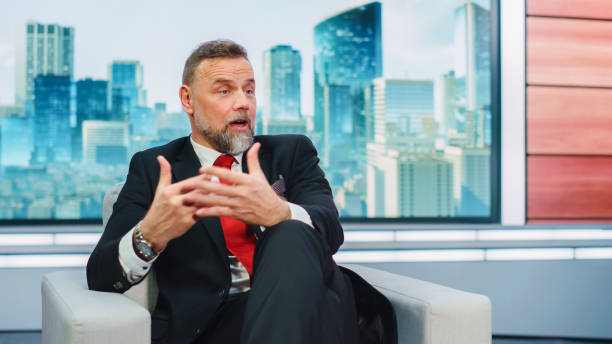 Talk Show TV Program Presenter and Celebrity Interview. Portrait of Handsome Male Host or Guest Expert Talk Politics, Science, News, Entertainment. Mock-up of Cable Channel Television Studio