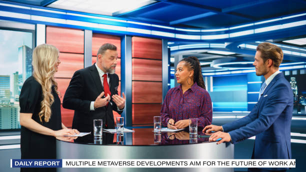 istock Talk Show TV Program: Four Diverse Specialists, Experts, Guests, Presenter, Host Discuss and Argue about Politics, Economy, Science, News. Mock-up Television Cable Channel Studio Debate 1407702984