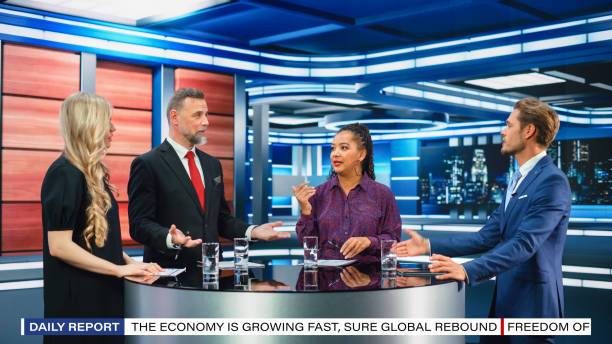 istock Talk Show TV Program: Four Diverse Specialists, Experts, Guests, Presenter, Host Discuss and Argue about Politics, Economy, Science, News. Mock-up Television Cable Channel Studio Debate 1407703000